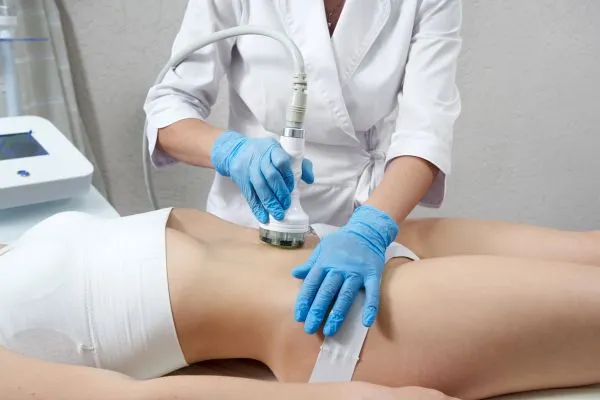 woman having HIFU treatment on her stomach to combat loose skin Henley In Arden following weight loss